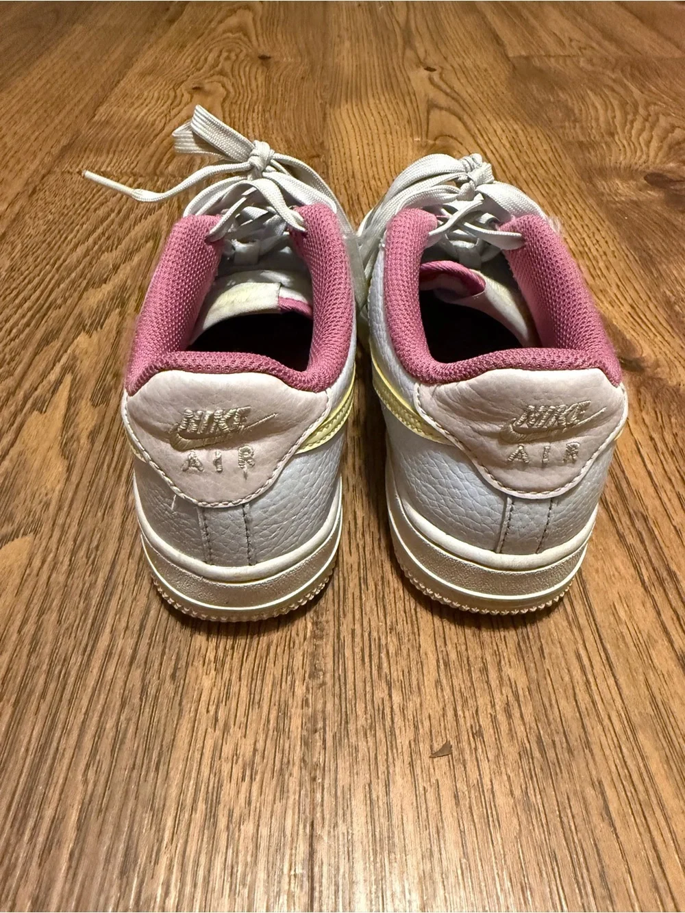Nike Kids White Sneakers with Yellow Swoosh and Pink Lining